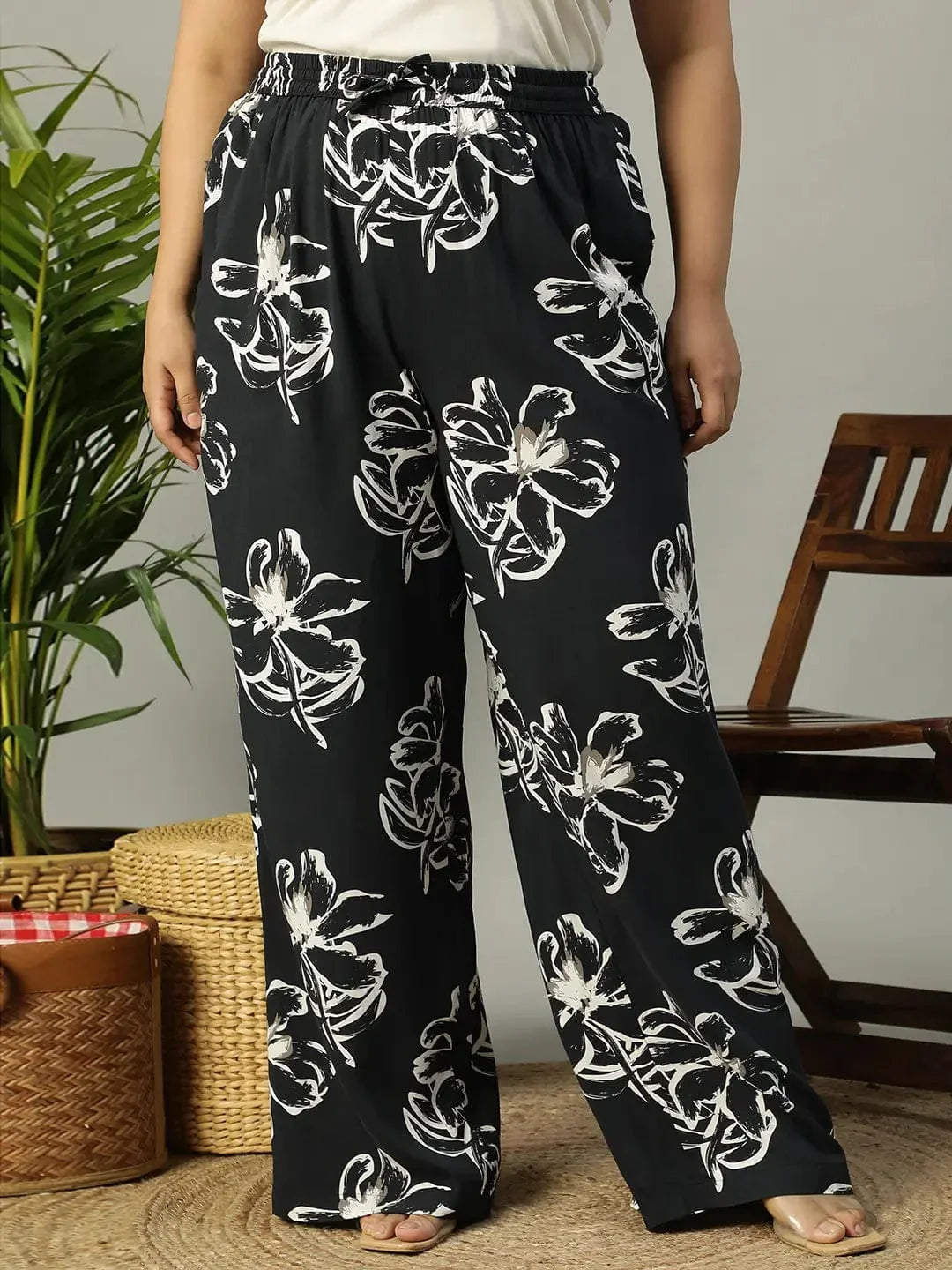 Plus size black floral print viscose pants with tie-knot waist