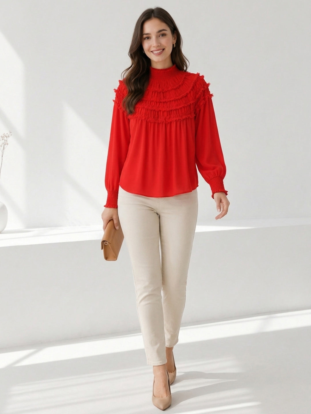 Red ruffled long sleeve blouse with high neck, paired with beige pants and heels for women's fashion
