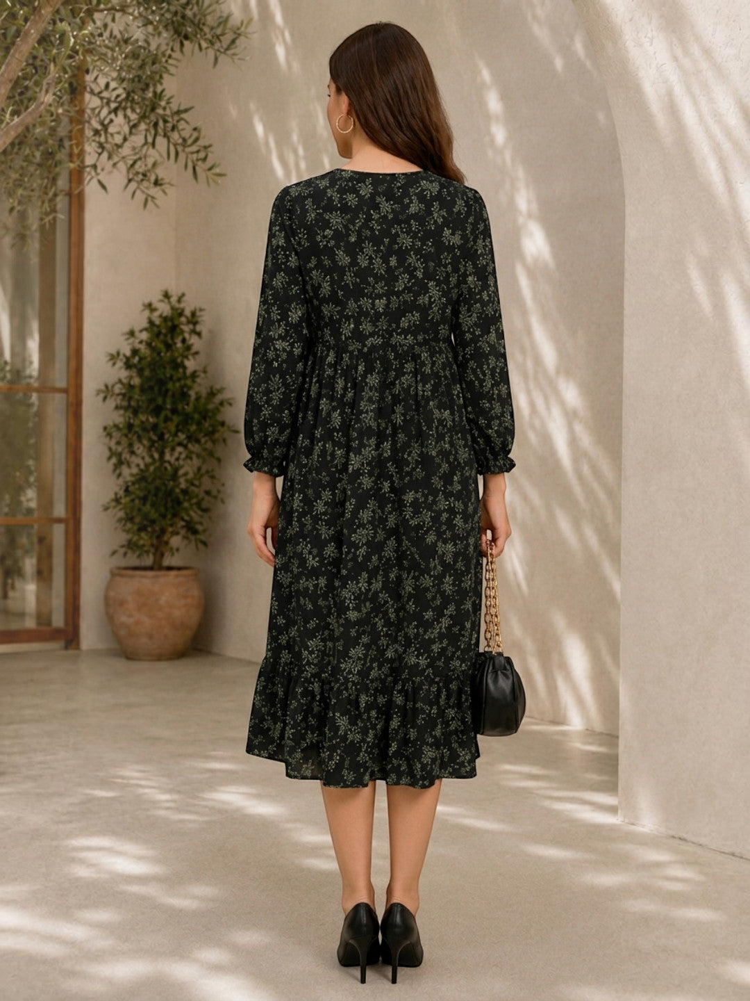 Black floral midi dress with ruffle hem, long sleeves, paired with heels and chain bag for women's fashion
