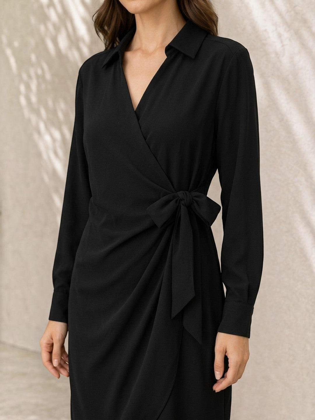 Black wrap dress with bow tie waist, long sleeves, and collared neckline for women's fashion