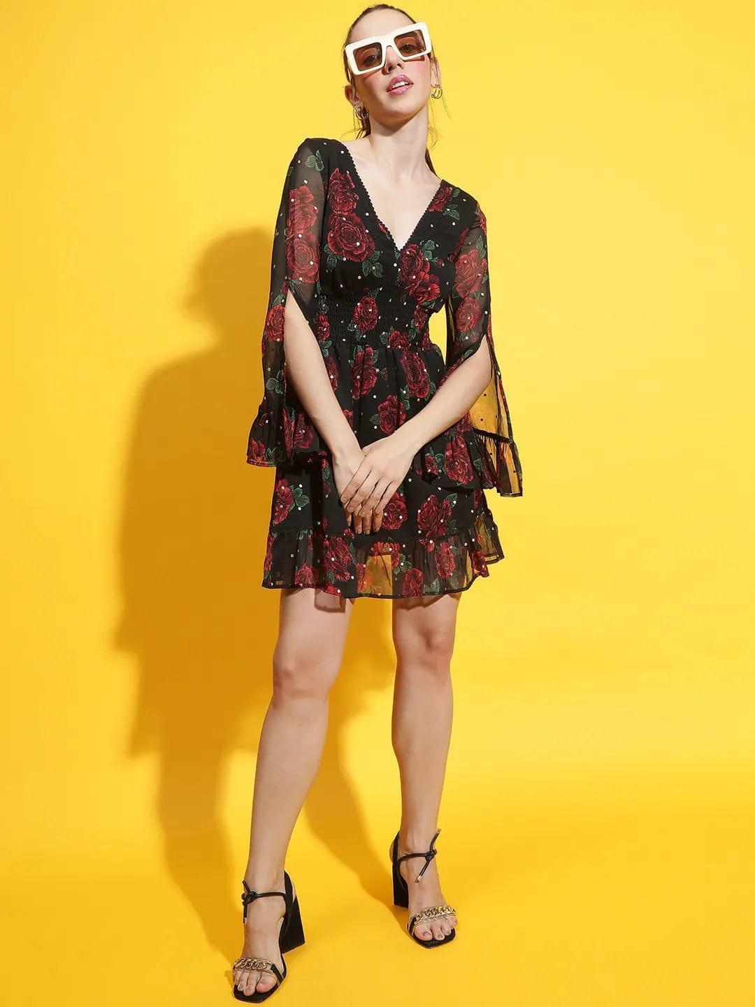 Oxolloxo black rose print lace dress with tiered ruffles and V-neck worn with sunglasses and heels