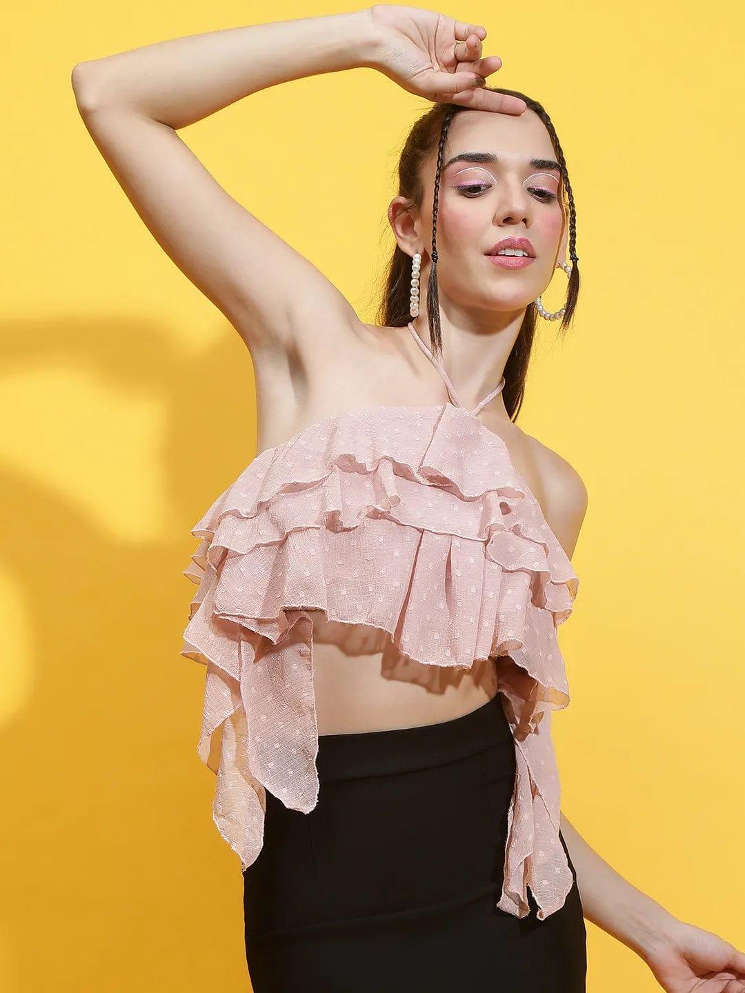 Oxolloxo pink halter neck crop top with layered ruffles worn by model with yellow background