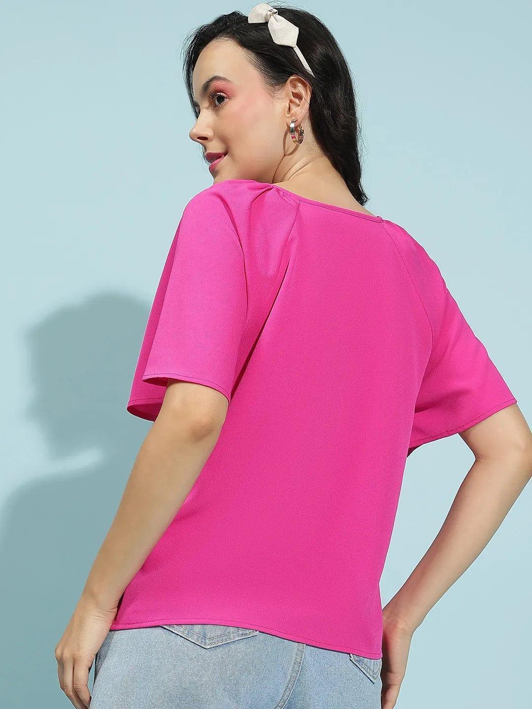 Back view of oxolloxo pink short sleeve blouse for women paired with light blue jeans